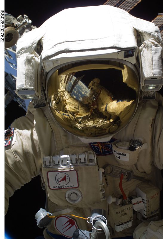 Cosmonaut Oleg Skripochka takes a photo of Dmitry Kondratyev during an EVA