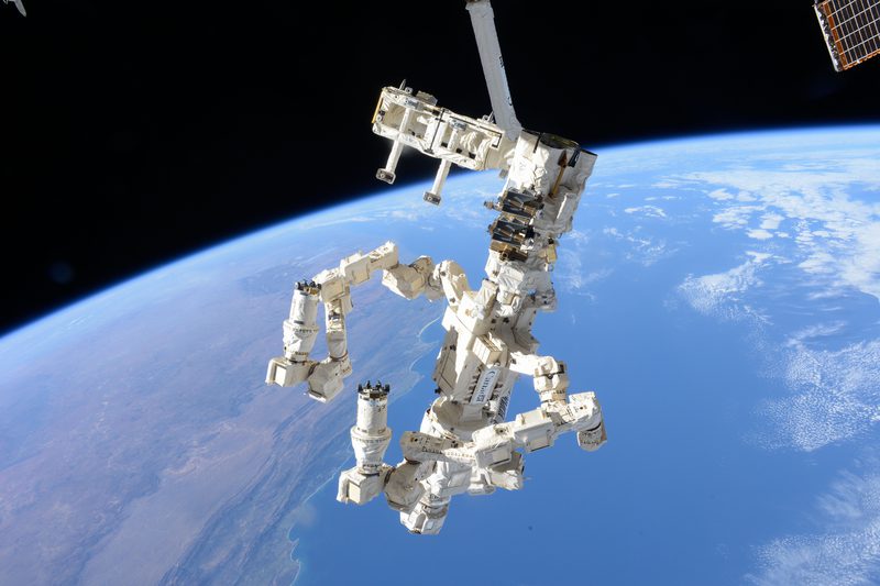 View of Earth and Canada Arm from the ISS