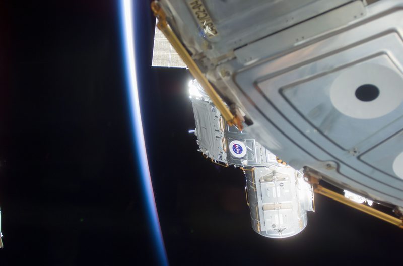 ISS and Earth horizon as photographed during Space Shuttle mission 104